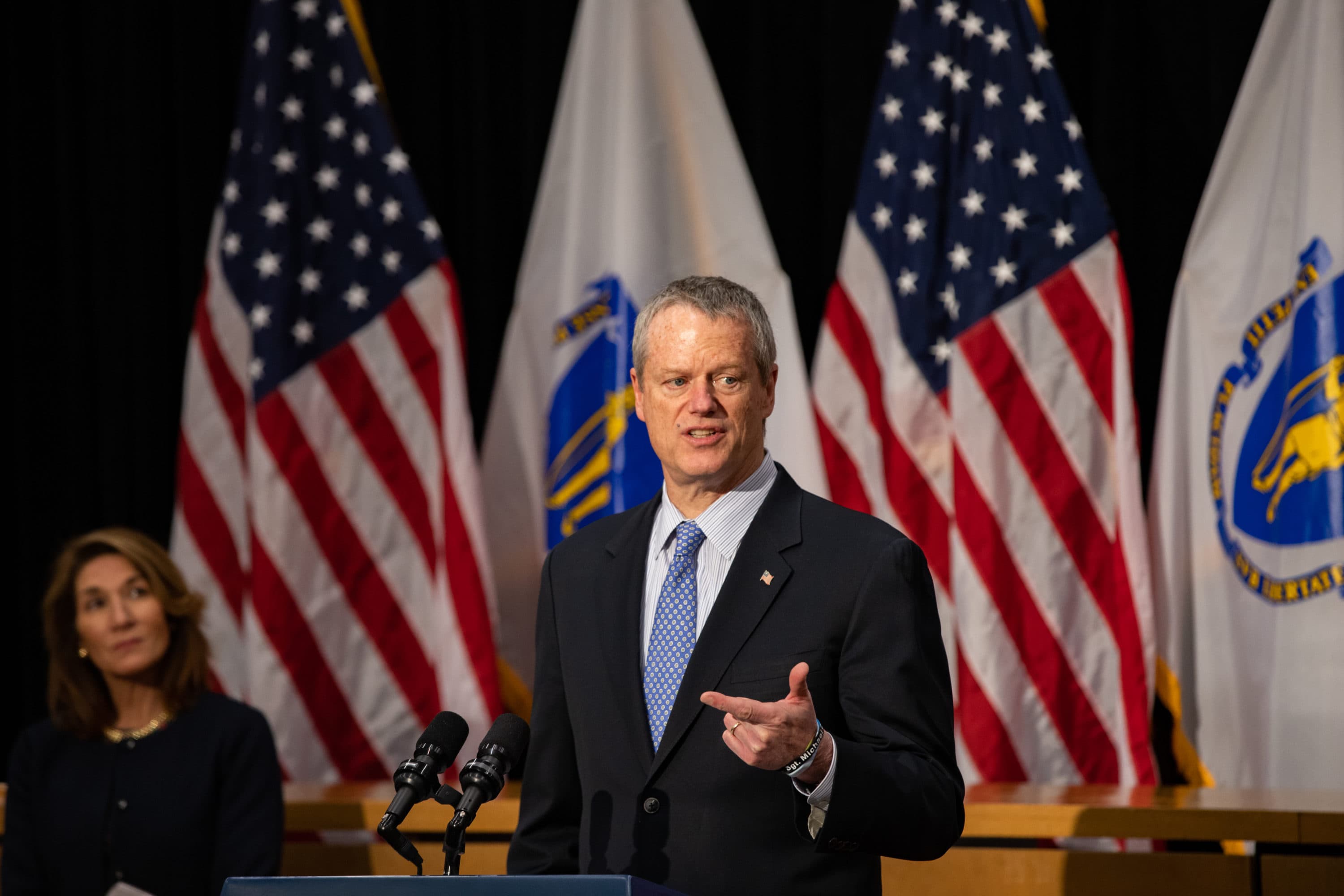 Lt. Gov. Karyn Polito watches as Massachusetts Gov. Charlie Baker addresses the media.(Chris Van Buskirk, SHNS)