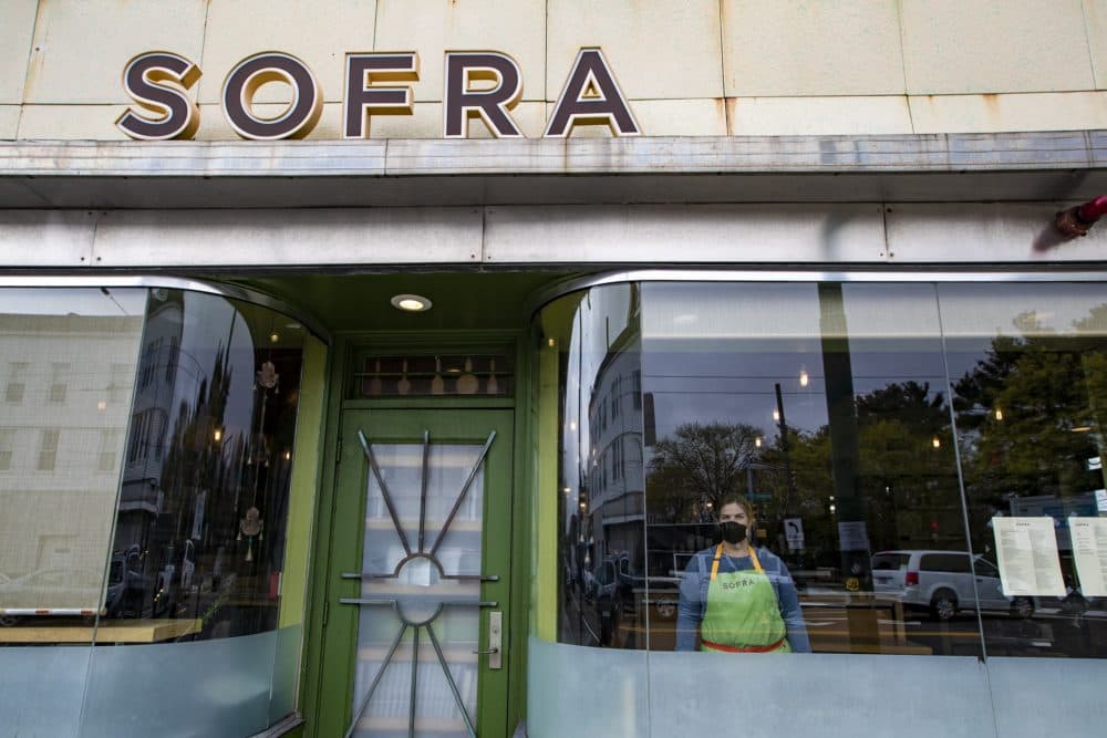 2020 James Beard award winner Ana Sortun stands in the window looking out at Sofra in Cambridge. (Jesse Costa/WBUR)