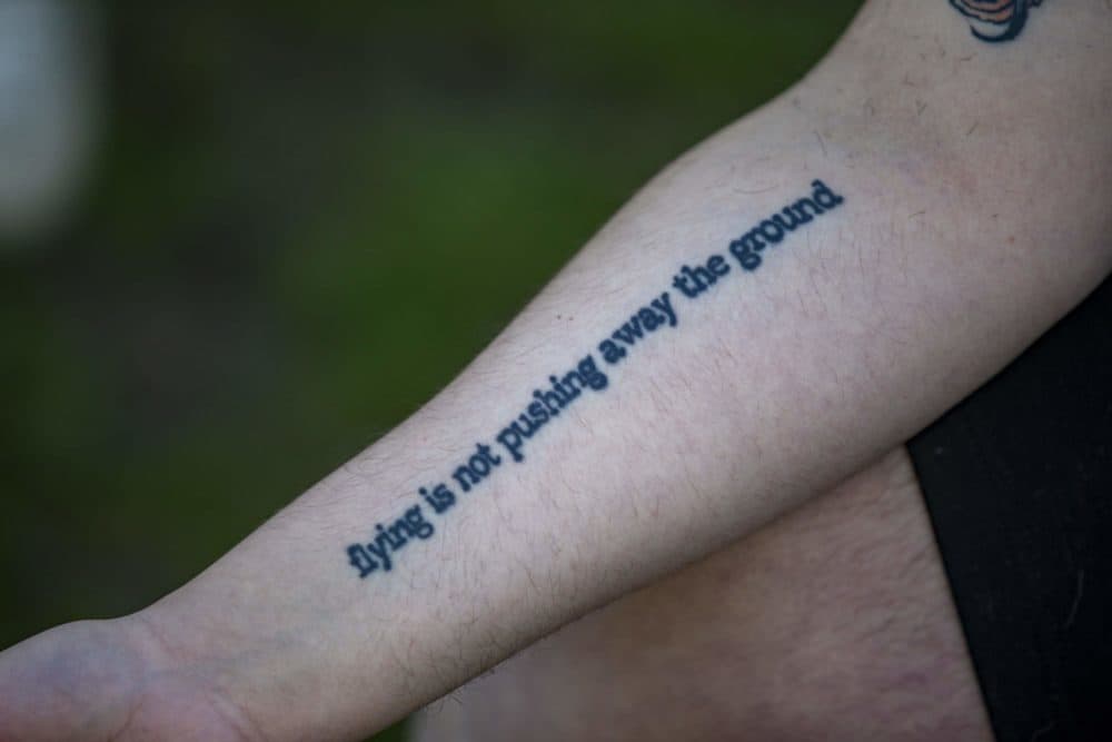 One of Ryley Copans many tattoos, this one is a quote from the Andrea Gibson poem, “I Sing the Body Electric, Especially When My Power’s Out.” (Jesse Costa/WBUR)
