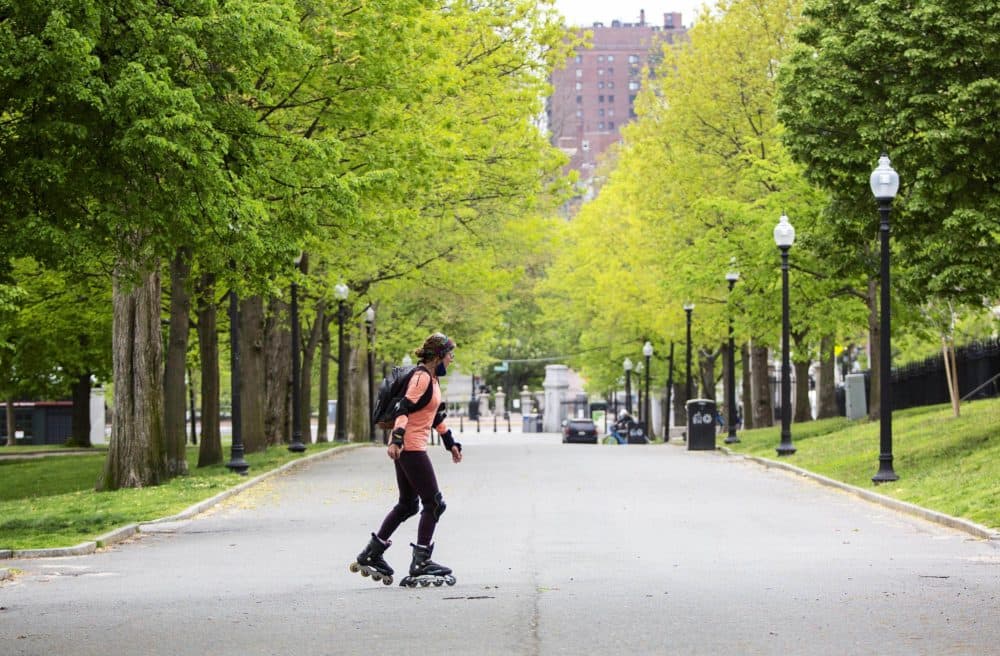 A woman skates down a deserted drive on Boston Common. (Robin Lubbock/WBUR)