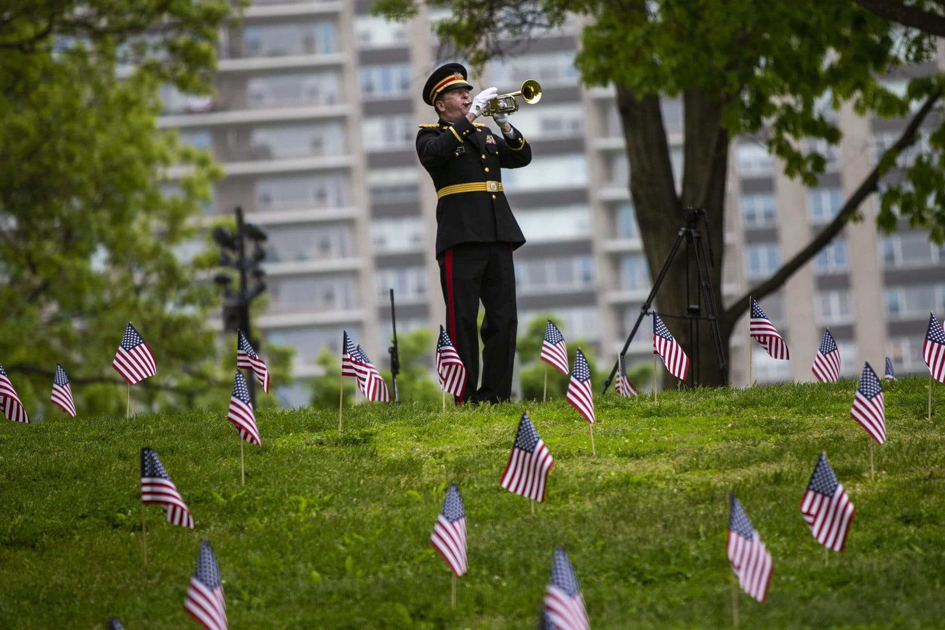 A bugler plays Taps after the wreath is placed at the base of the Soldiers and Sailors Monument. (Jesse Costa/WBUR)