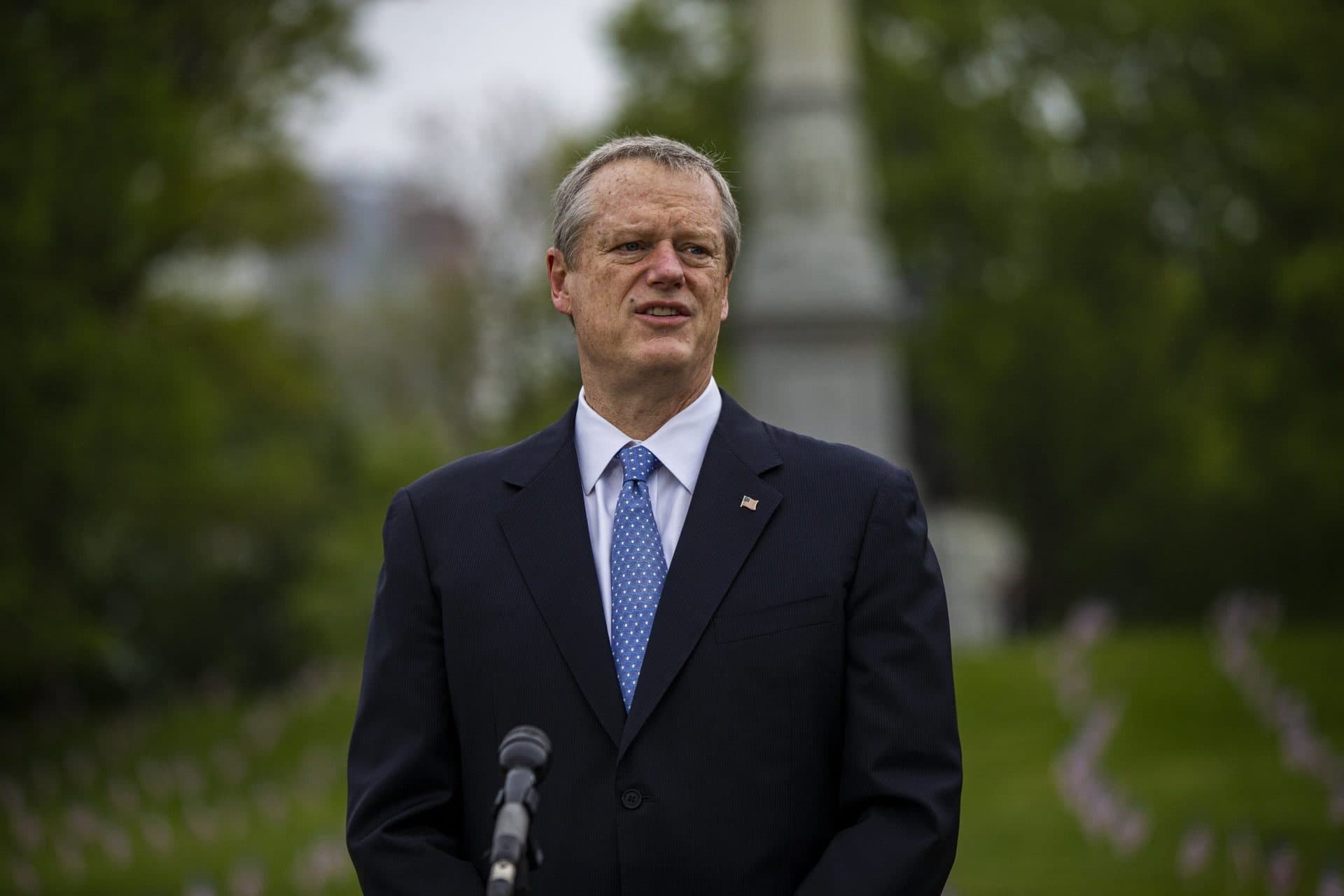 Gov. Charlie Baker stands during the Memorial Day wreath ceremony in the Boston Common. (Jesse Costa/WBUR)