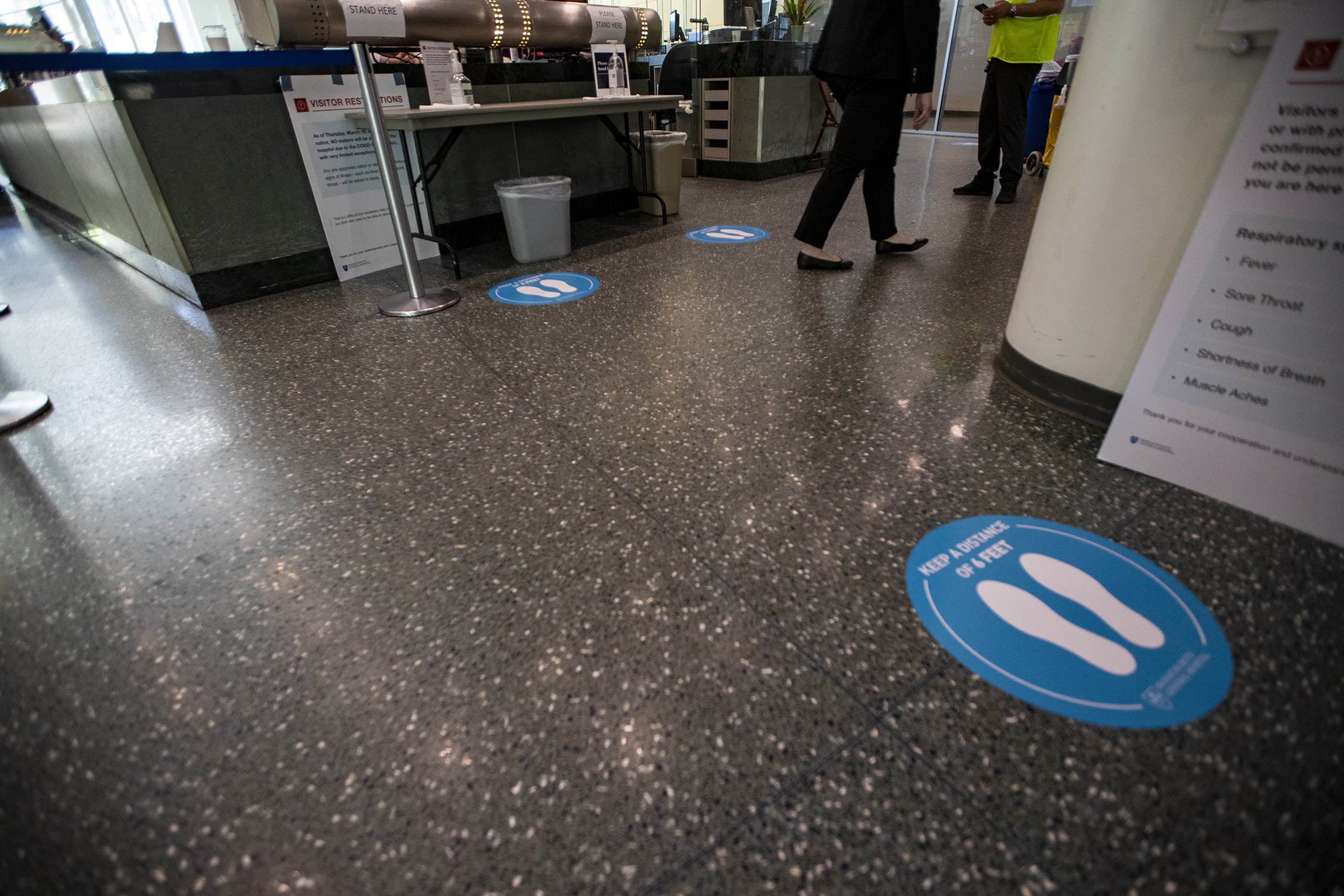 Stickers, at 6-foot intervals, map the path for patients at MGH.(Jesse Costa/WBUR)