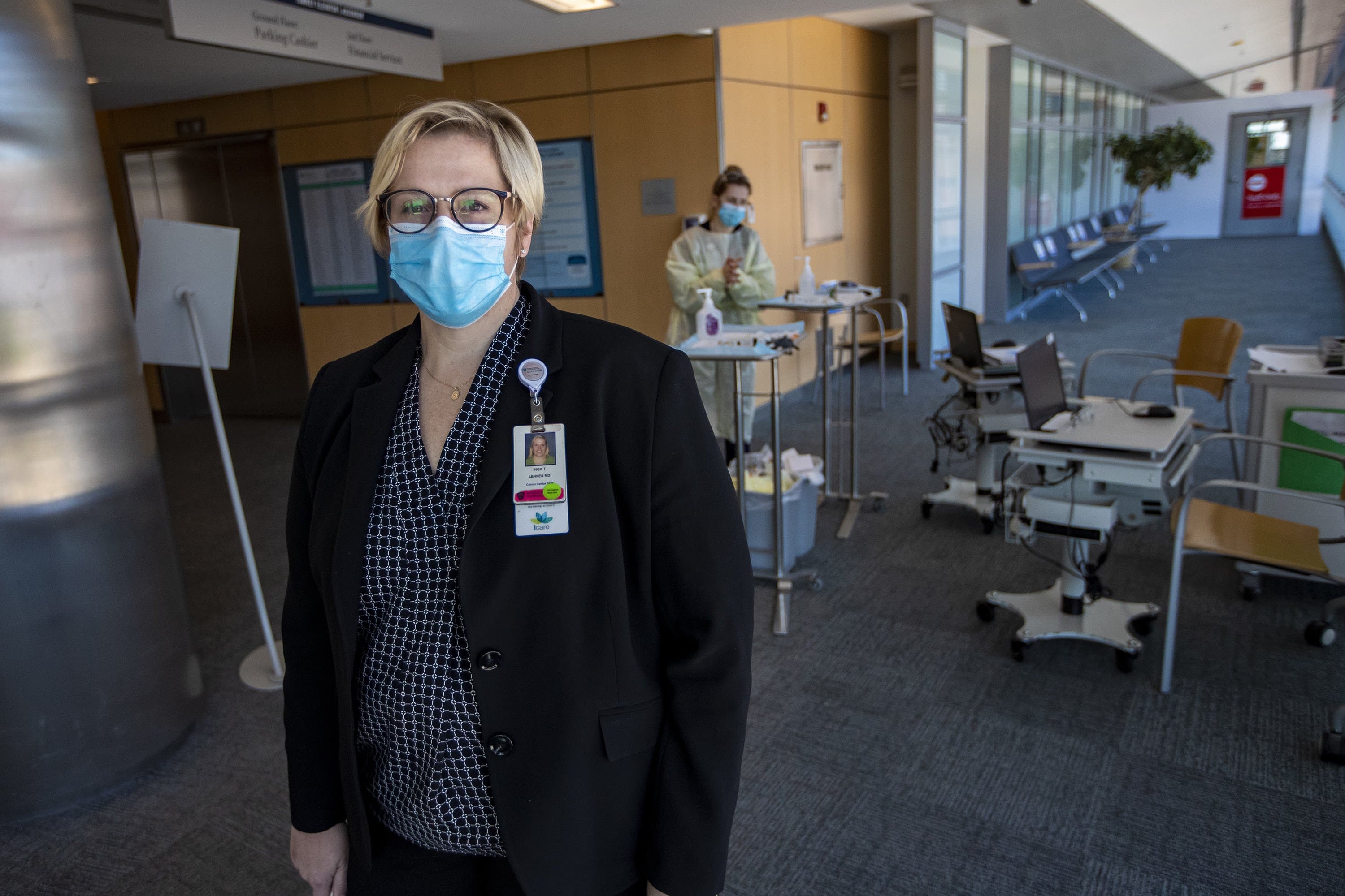 Dr. Inga Lennes stands in front of the screening area where patients temperatures are taken upon being admitted to Mass. General Hospital. (Jesse Costa/WBUR)