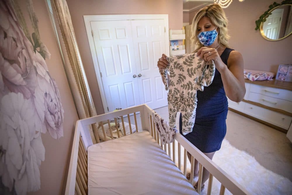 The extended isolation period gave Amanda Joyce and her husband Patrick some extra time to set up the room for a baby girl she's expecting in early August. (Jesse Costa/WBUR)