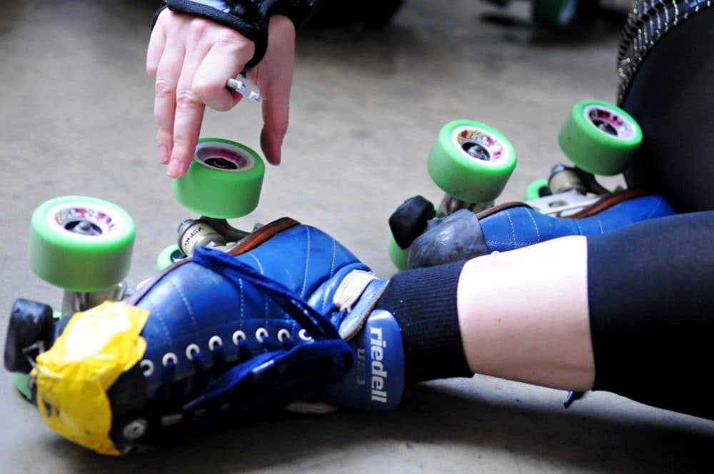 A skater adjusts her Riedell Skates. (Dawn Villella/AP)