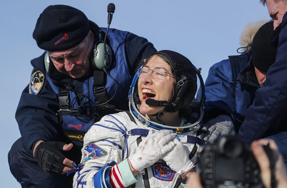 U.S. astronaut Christina Koch reacts shortly after the landing of the Russian Soyuz MS-13 space capsule about 150 km south-east of the Kazakh town of Zhezkazgan, Kazakhstan, Thursday, Feb. 6, 2020. (Sergei Ilnitsky/AP Photo)