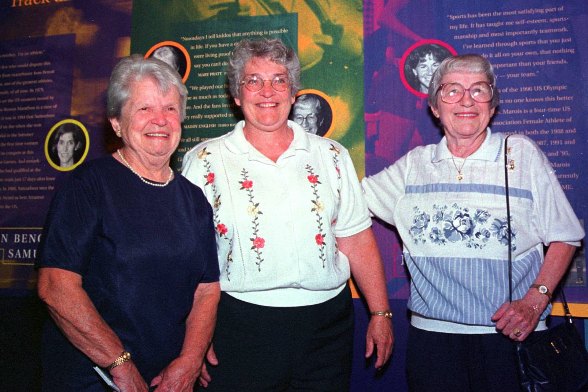 Former women's professional baseball players Mary Pratt, left, of Quincy, Mass., and Maddy English, right, of Everett, Mass., are joined by their friend Marie Cronin, center, at the opening of the New England Women's Sports Hall of Fame in Saugus, Mass. Pratt and English were members of the All-American Girls Professional Baseball League in the 1940s. (AP Photo/Steven Tackeff, File)