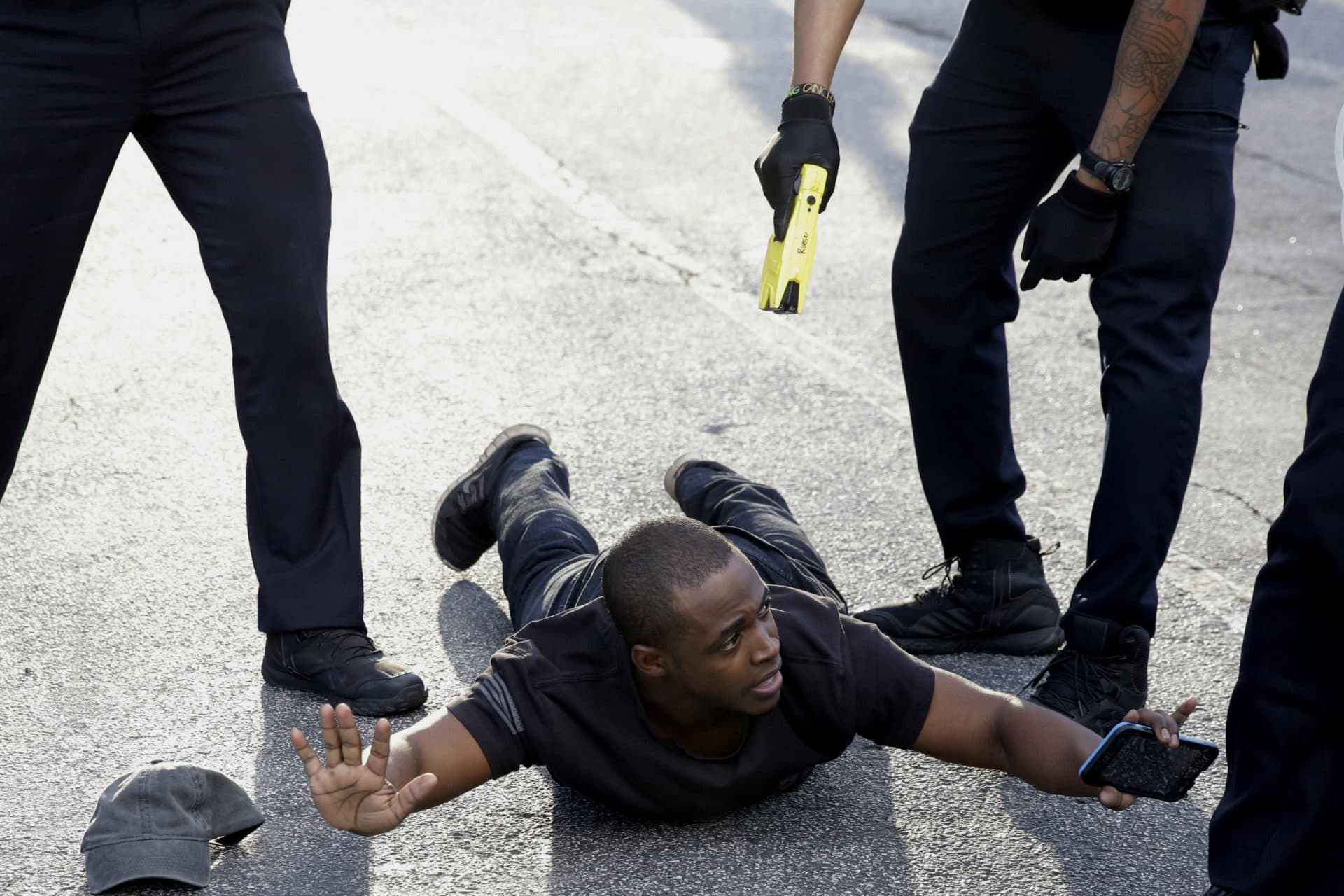 A demonstrator is detained by Atlanta Police during a protest, Saturday, May 30, 2020 in Atlanta. (AP Photo/Brynn Anderson)