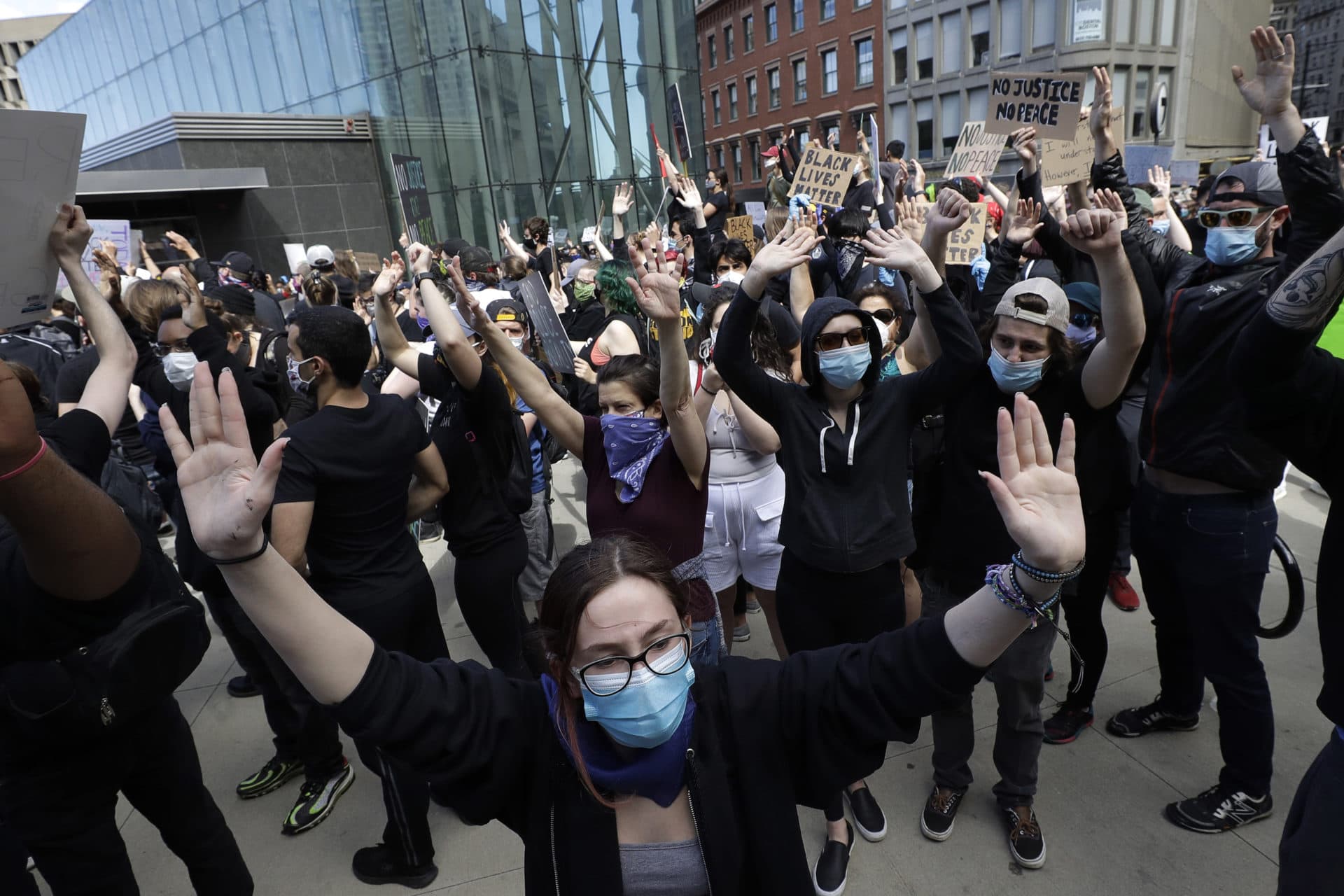 Protesters demonstrate Sunday, May 31, 2020, in Boston, over the death of George Floyd who died after being restrained by Minneapolis police officers on May 25. (AP Photo/Steven Senne)