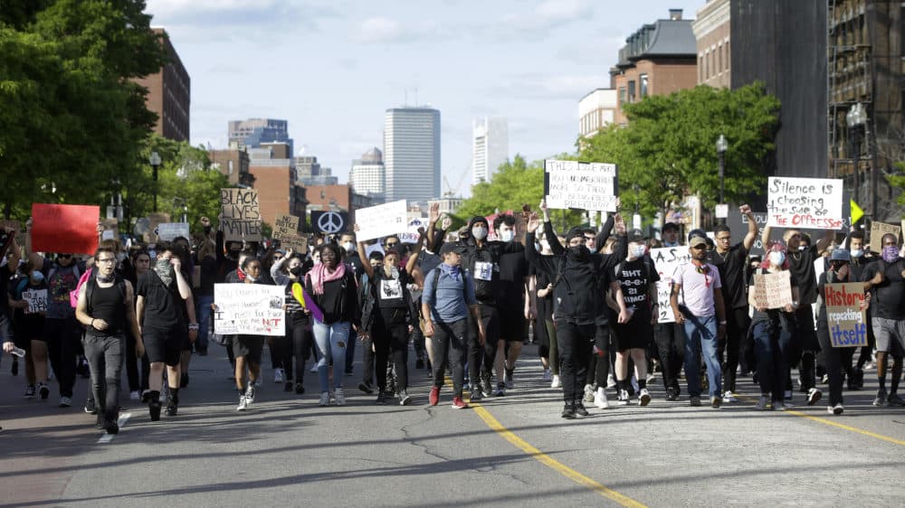 Protesters demonstrate Sunday, May 31, 2020, in Boston, over the death of George Floyd, a black man who was in police custody in Minneapolis. (Steven Senne/AP Photo)