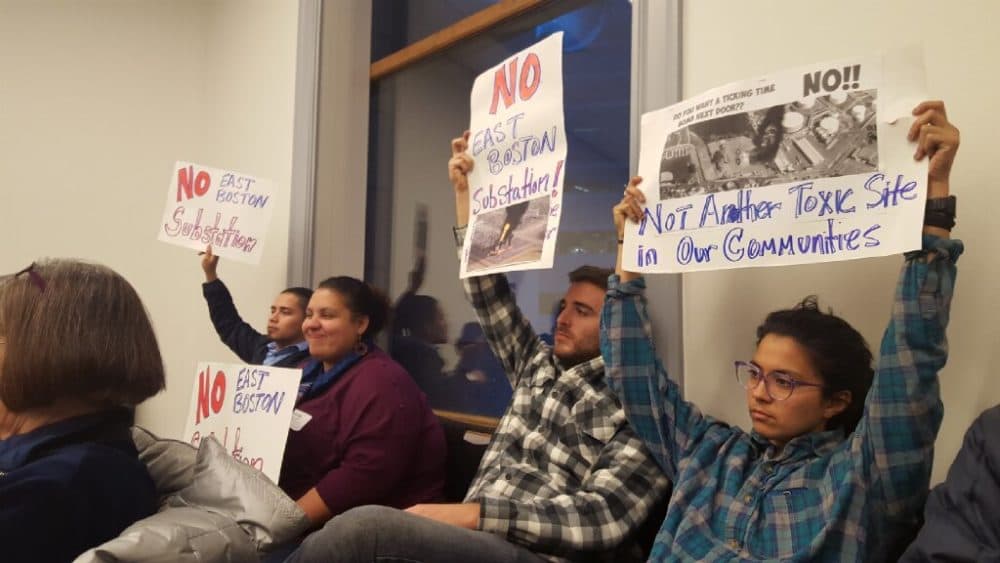 At a community meeting in Chelsea, community members register their disagreement with a plan to site a new high-voltage electrical substation in East Boston. (Courtesy GreenRoots)