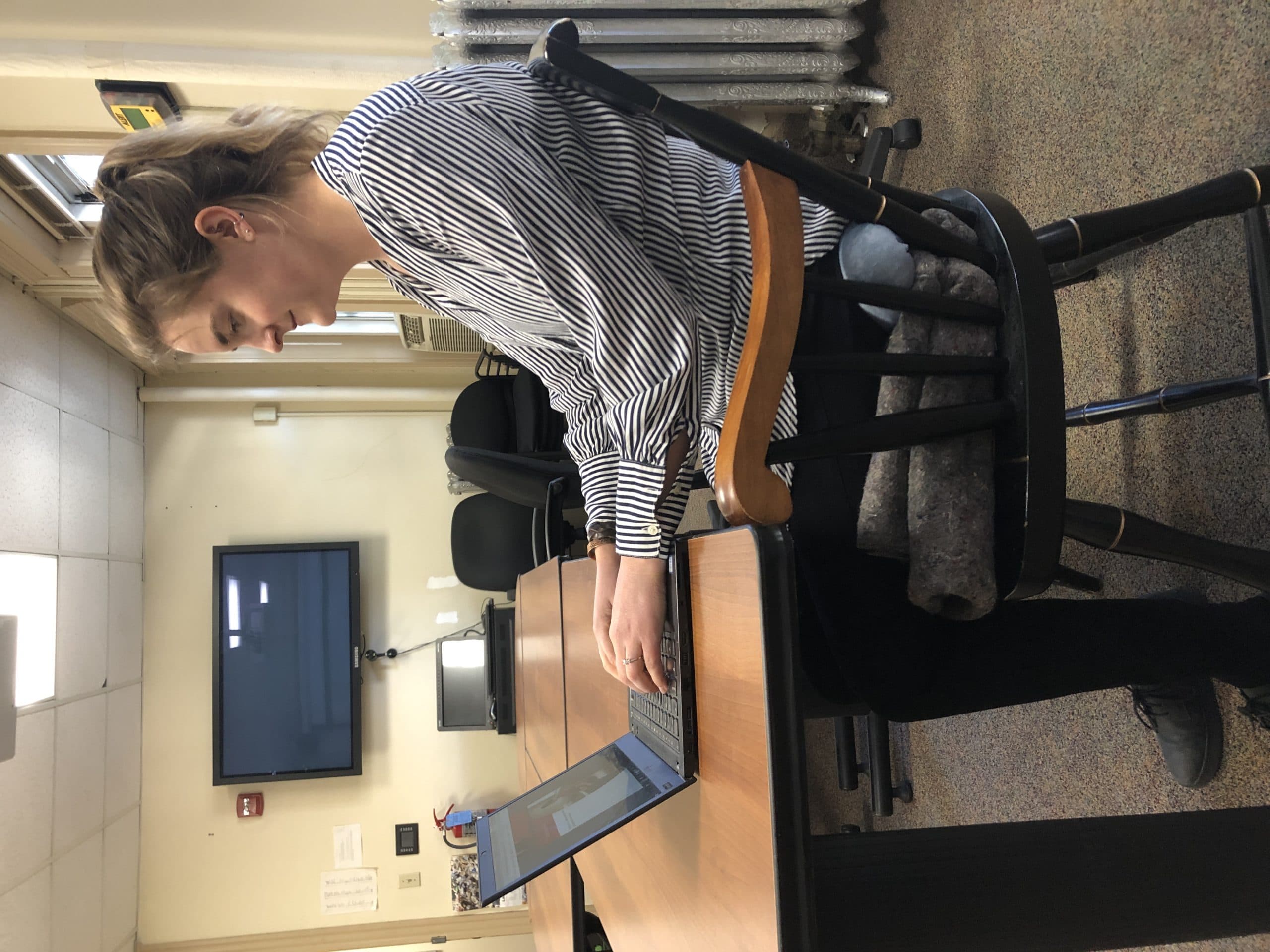 An example of using a cushion to sit up higher in your chair while working from home. (Courtesy Carolyn Herkenham)