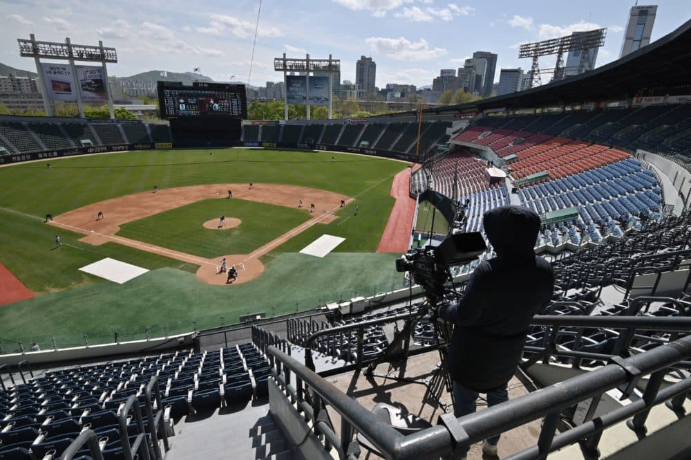 Professional sport returned to South Korea on April 21 as coronavirus restrictions ease, with the first pitch thrown in a baseball preseason derby in front of empty stands. (Jung Yeon-je /AFP via Getty Images)
