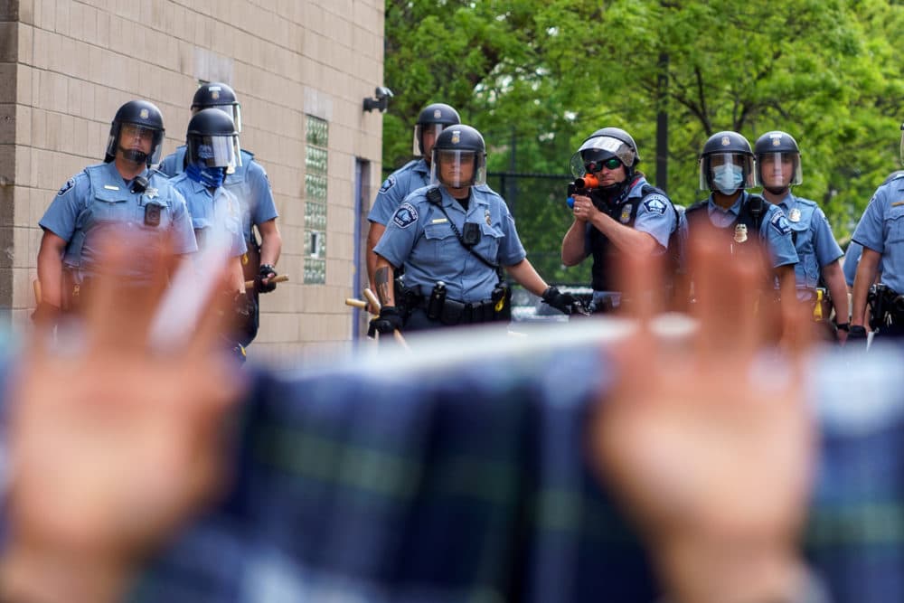 Protesters are trapped between police and other protesters who gathered in a call for justice for George Floyd following his death in Minneapolis, Minnesota. (Kerem Yucel/AFP/Getty Images)