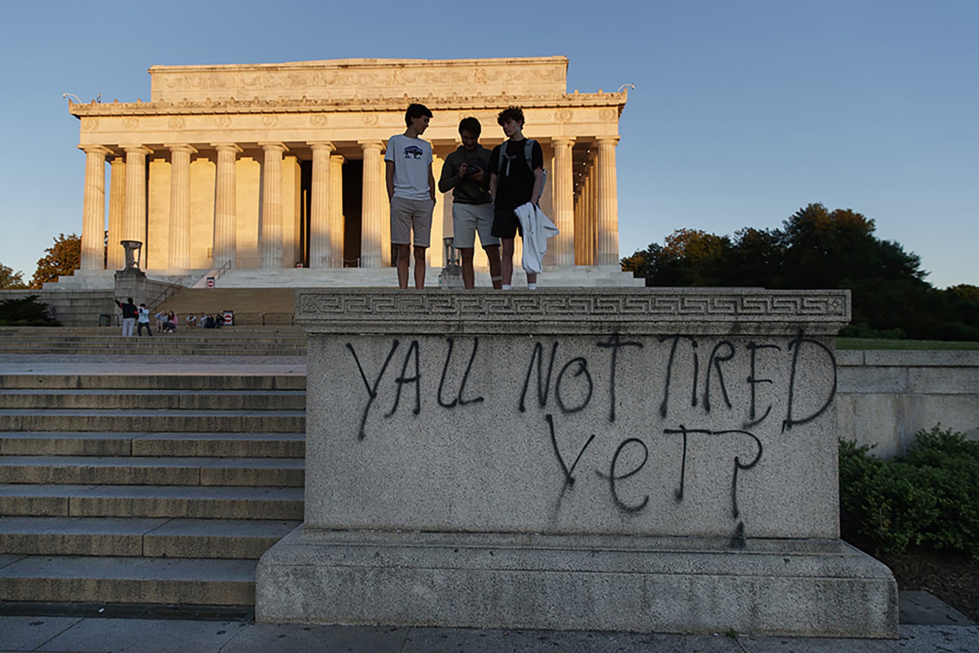 Spray paint that reads &quot;Yall Not Tired Yet?&quot; is seen on the base fo the Lincoln Memorial on the National Mall in Washington, early Sunday, May 31, 2020, the morning after protests over the death of George Floyd. Floyd died after being restrained by Minneapolis police officers on Memorial Day. (AP Photo/Carolyn Kaster)