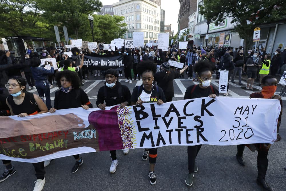 Protesters demonstrate on Sunday in Boston, over the death of George Floyd. (Steven Senne/AP)