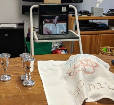 The author's family room table set up for kiddush and HaMotzi blessings for after a special Saturday morning service they attended on Zoom for sixth-graders and their families. (Courtesy)