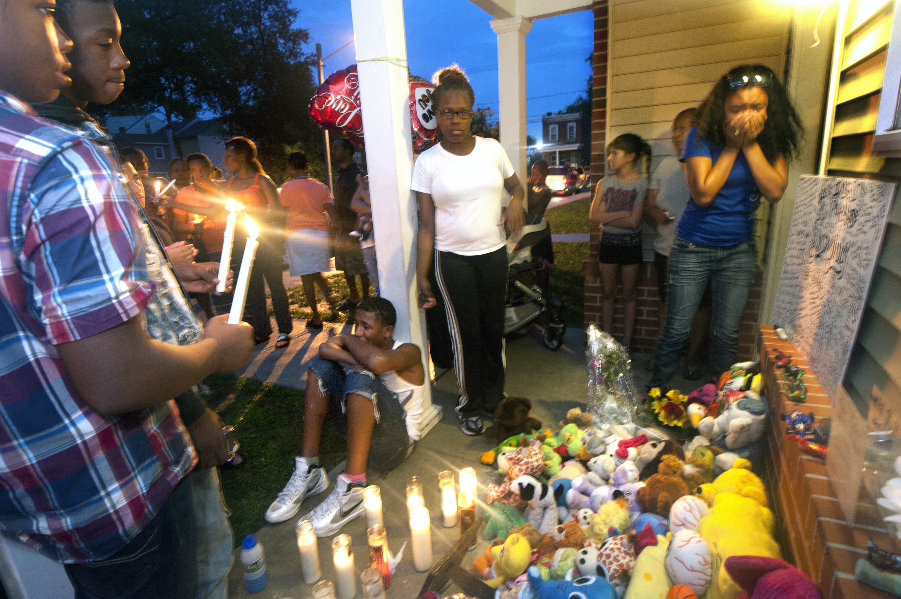 Friends and family members react to the murder of five-year old Dominick Andujar at a vigil on the dead boy's doorstep on Sept. 5, 2012. (Photo by April Saul)