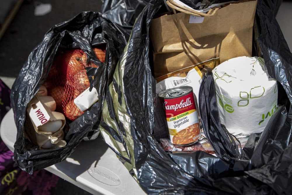 The bags of groceries given out at Rosie's Place include eggs, flour, canned goods and paper products.