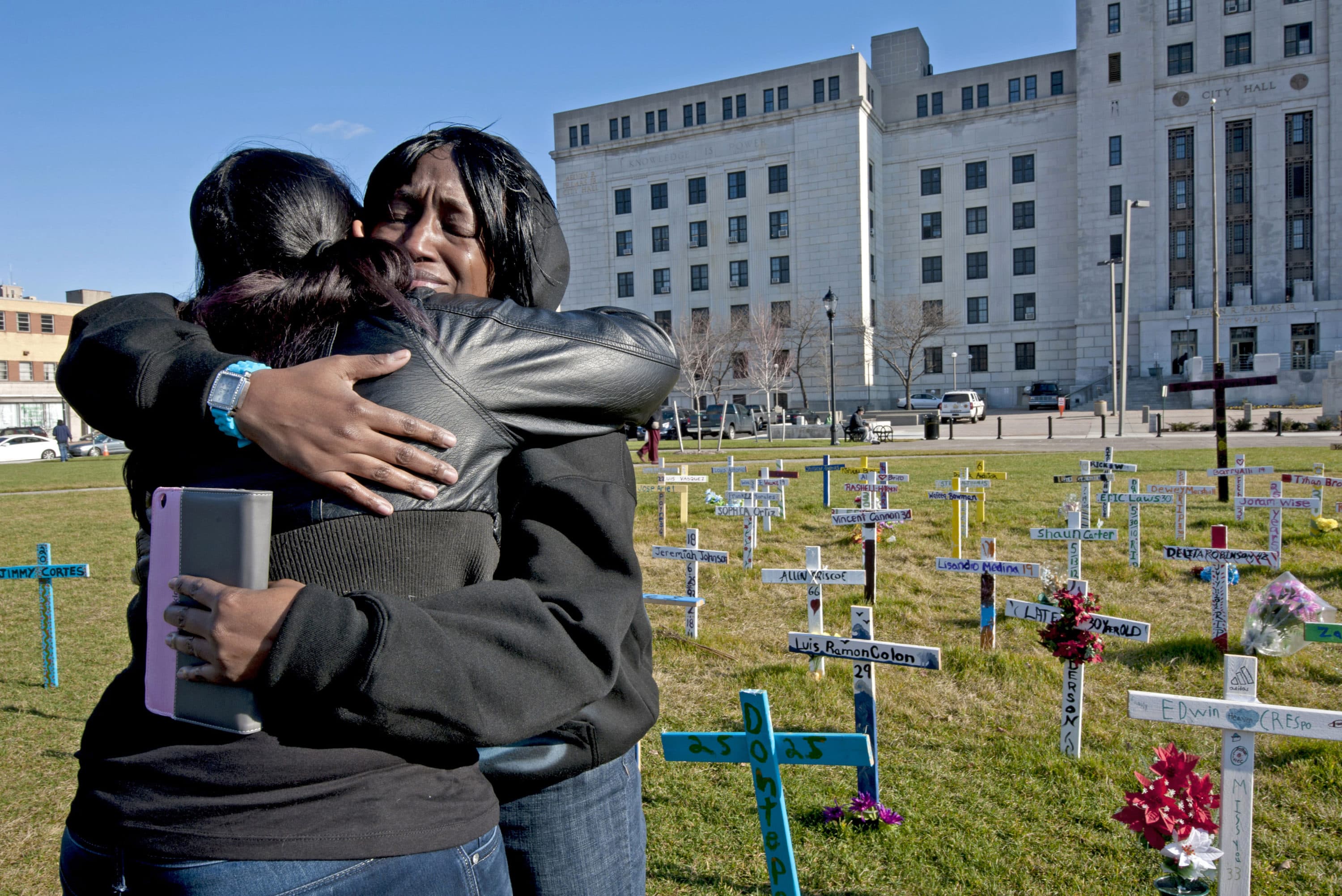 At the field of crosses in Camden on December 15, 2012, Tyesha Pegues grieves for her sister, Rasheeda Pegues, who was shot and killed outside her Ferry Avenue apartment. (Photo by April Saul)