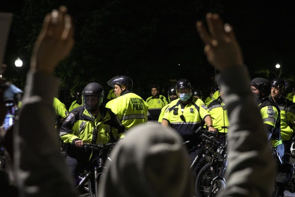 Protesters coming down Beacon Street find the road blocked by bicycle police. (Robin Lubbock/WBUR)