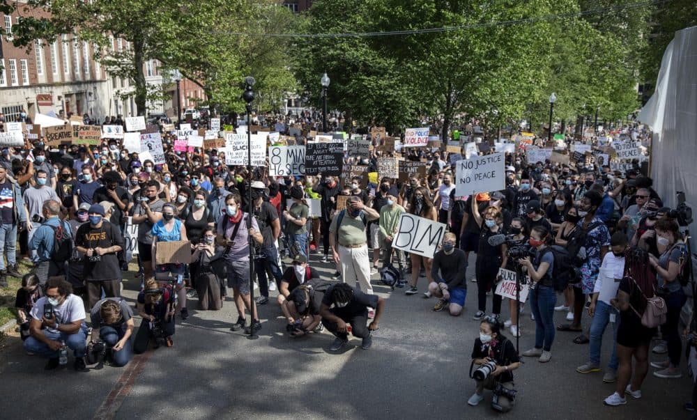 Protester fill the corner of Boston Common below the Shaw memorial. (Robin Lubbock/WBUR)