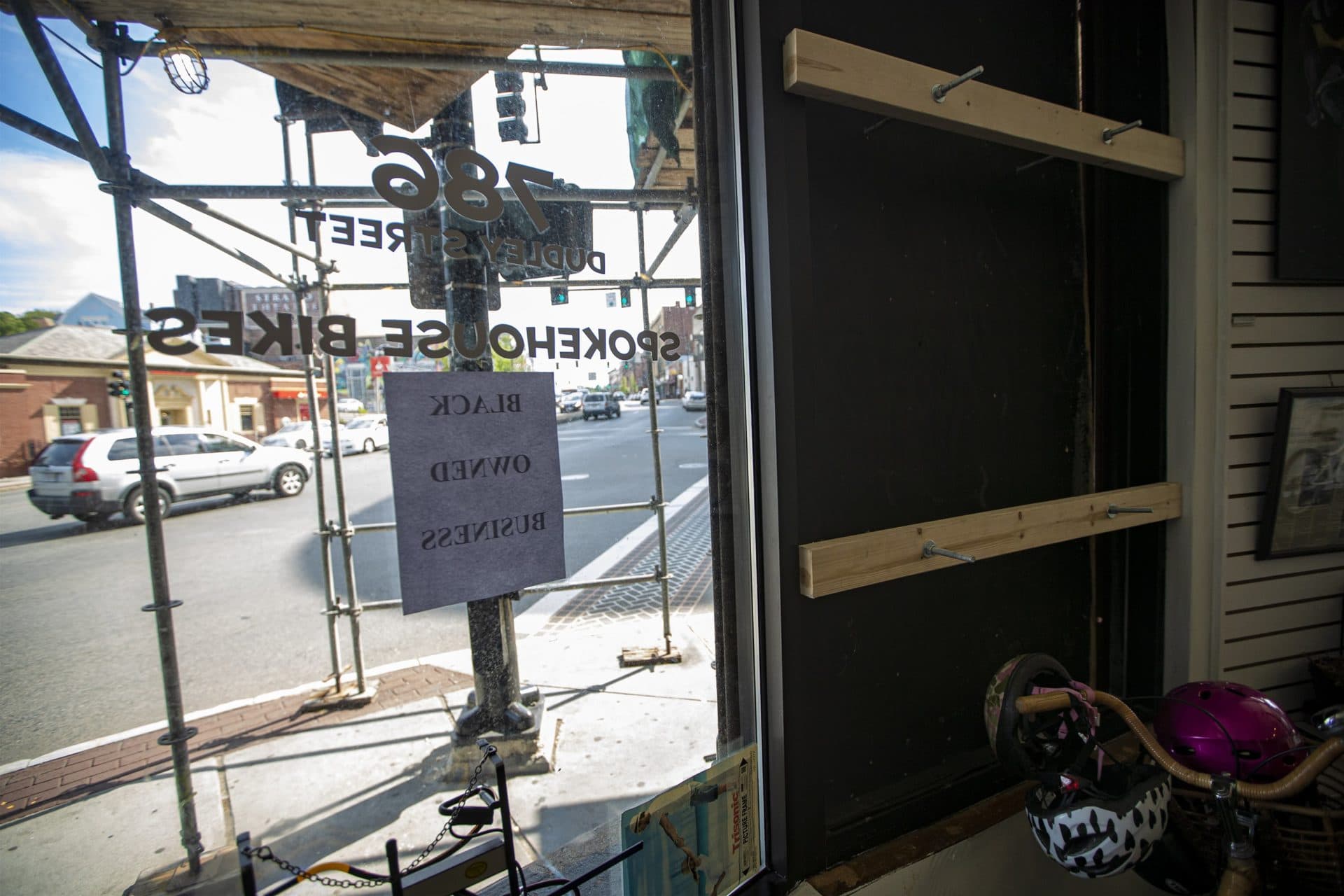 The window of Spokehouse that was damaged during the looting after the protest on May 31. (Jesse Costa/WBUR)