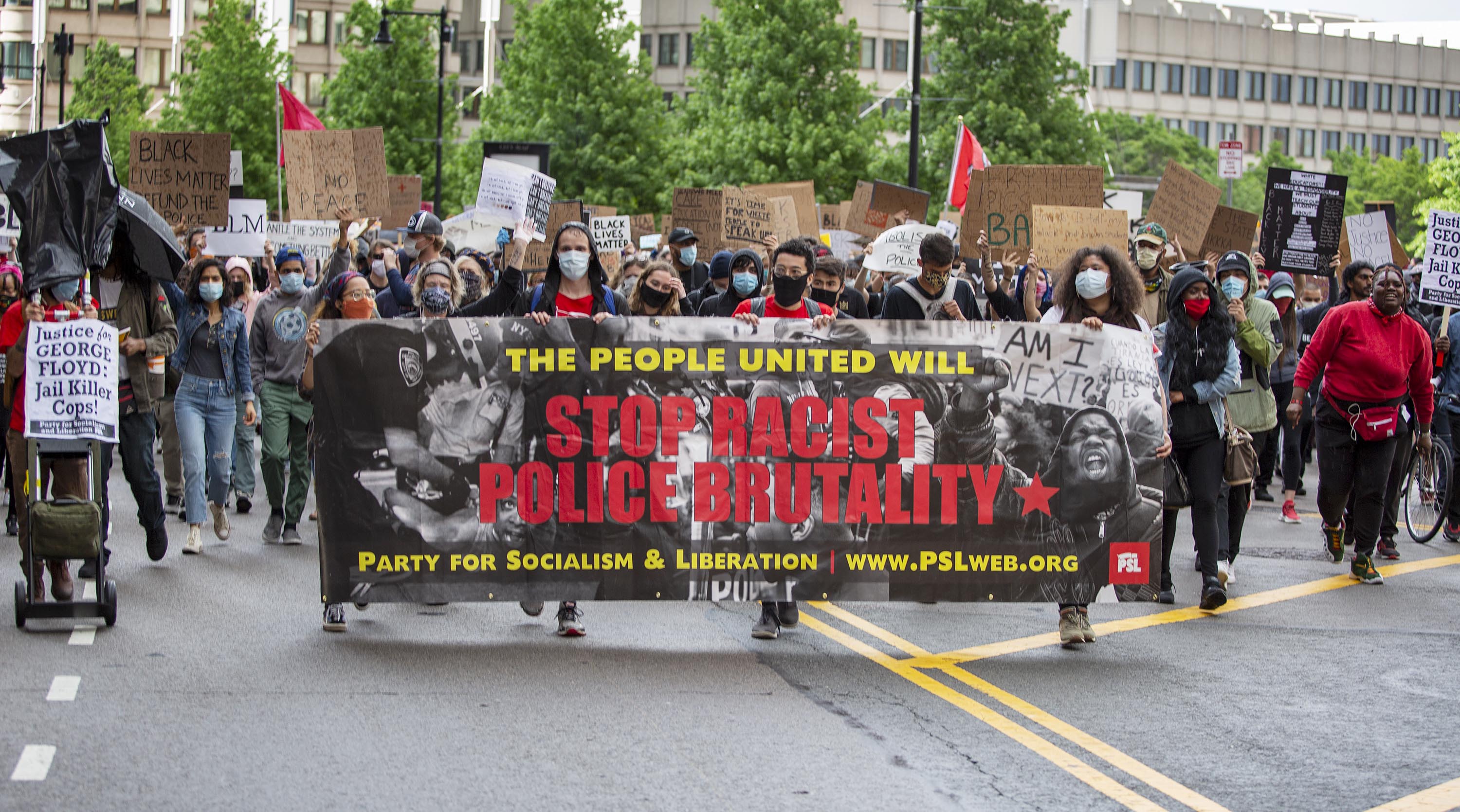 Marchers set out from City Hall Plaza, heading for Ruggles MBTA station. (Robin Lubbock/WBUR)