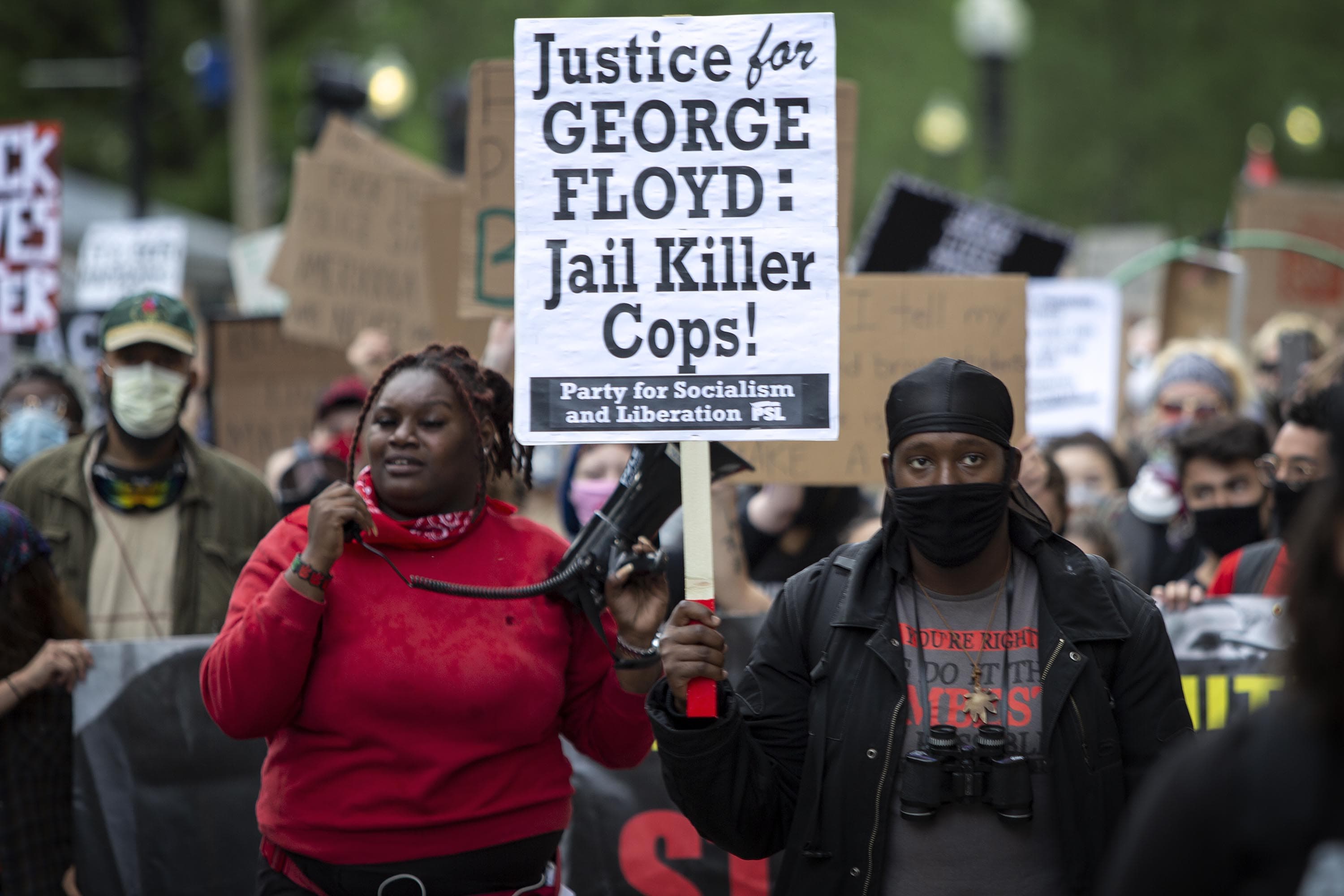 Marchers walk along Tremont St. towards Ruggles. (Robin Lubbock/WBUR)