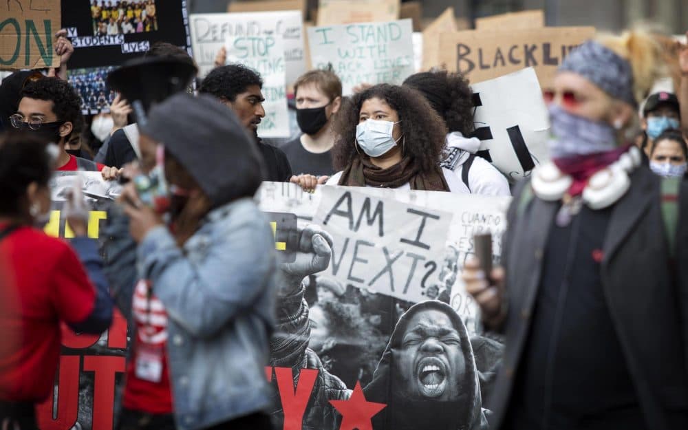 Protesters make their way down Tremont Street from City Hall Plaza. (Robin Lubbock/WBUR)