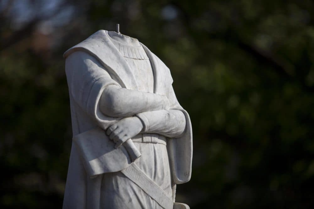 The now headless statue of Christopher Columbus in Christopher Columbus Waterfront Park in Boston. (Robin Lubbock/WBUR)