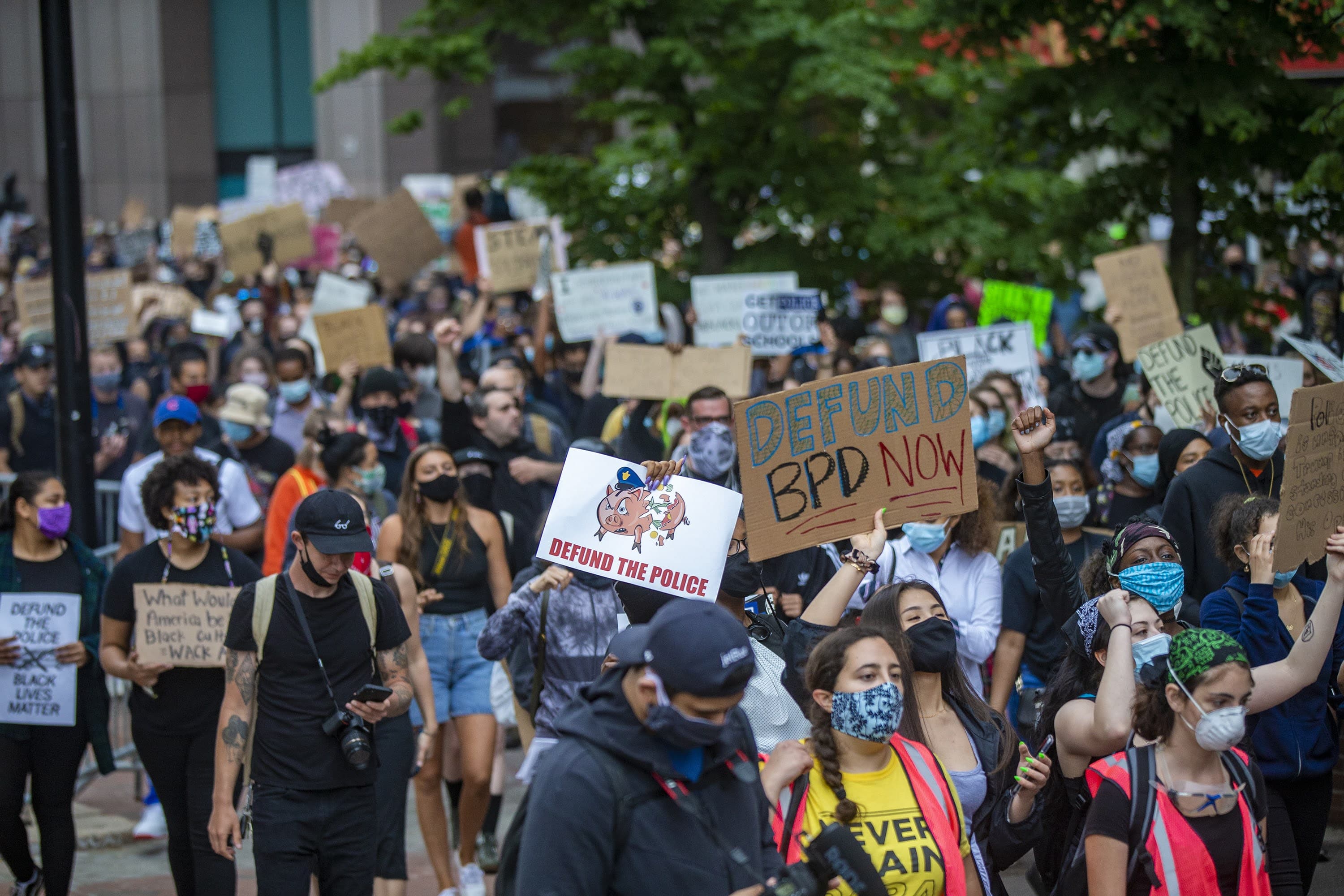 Hundrreds of protesters march into Boston City Hall Plaza during the F.T.P. March to Defund Police and Fund Our Communities. (Jesse Costa/WBUR)