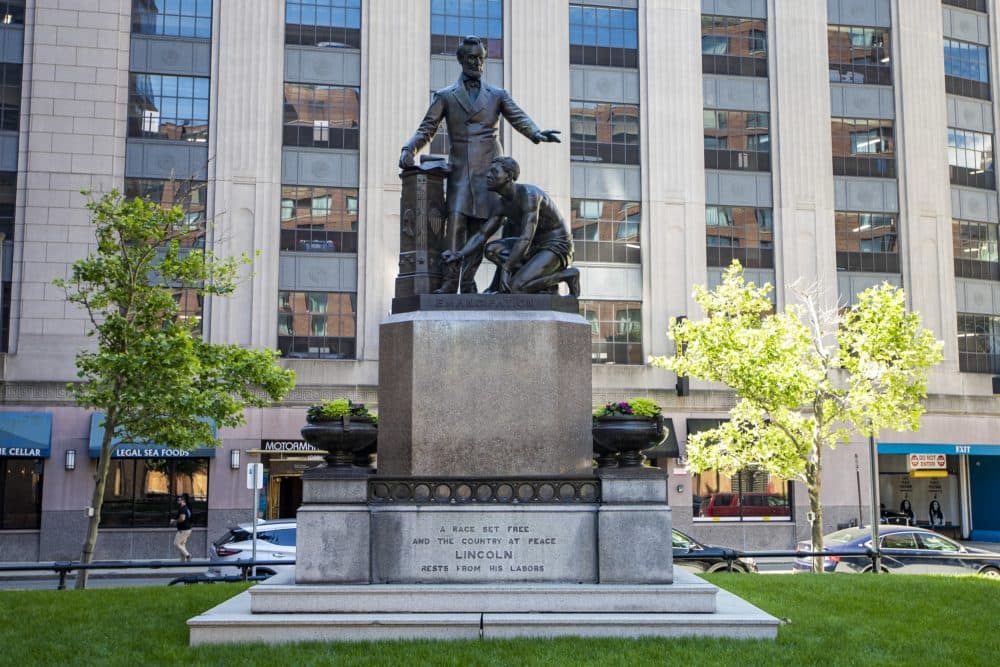 The statue in the city's Park Square is a replica of the Emancipation Memorial in Washington and depicts Lincoln with one hand raised above a kneeling man with broken shackles on his wrists. (Jesse Costa/WBUR)