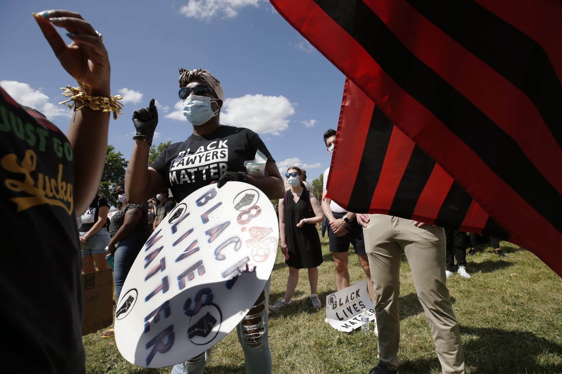 People participate in a Juneteenth rally at Town Field in Dorchester. (Michael Dwyer/AP)