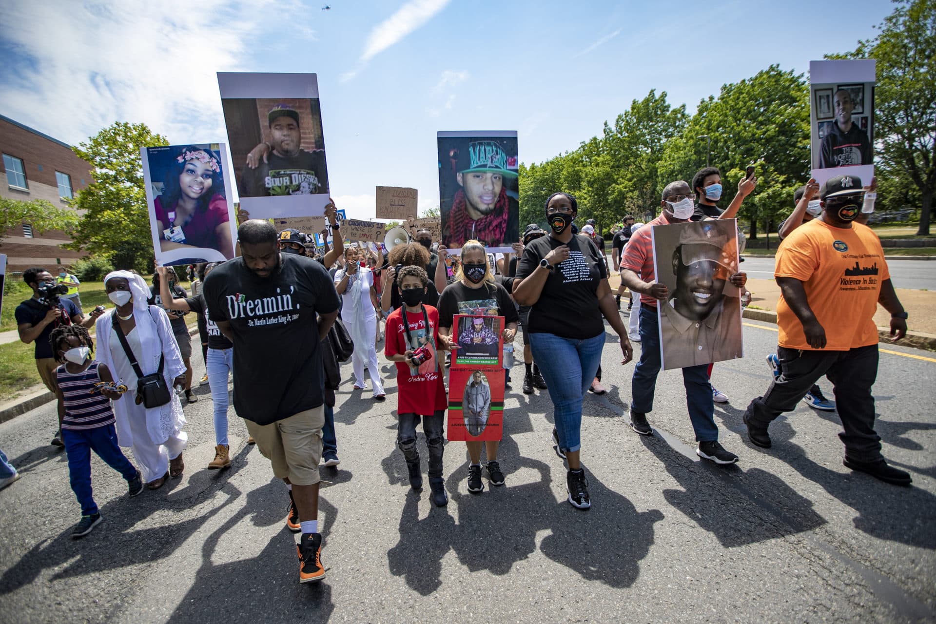 Organizer Monica Cannon-Grant leads protesters up Tremont Street as the group leaves the area around the Reggie Lewis Center. (Jesse Costa/WBUR)