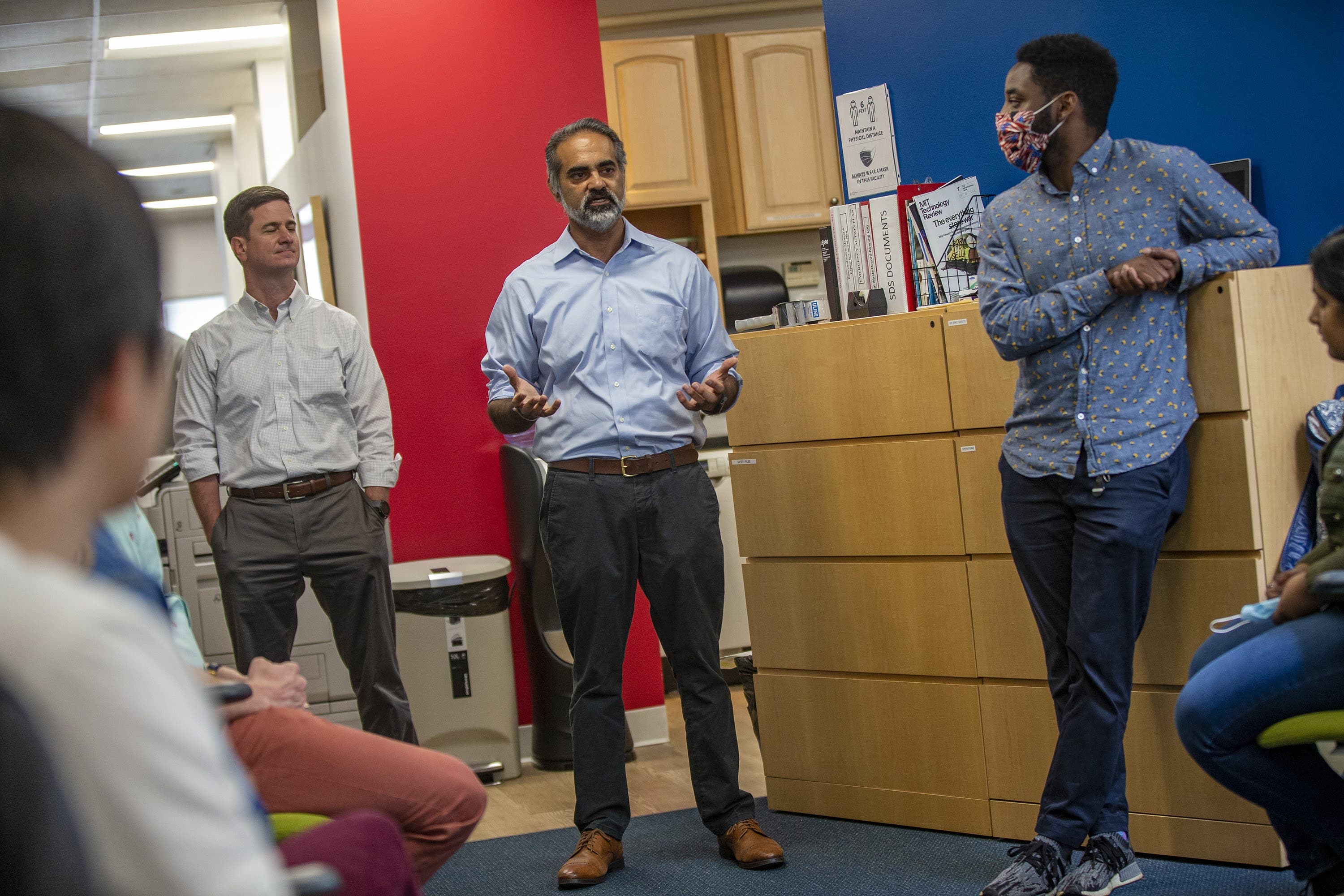 Sherlock Biosciences CEO Rahul K. Dhanda speaks to the team in the “bullpen.” (Jesse Costa/WBUR)