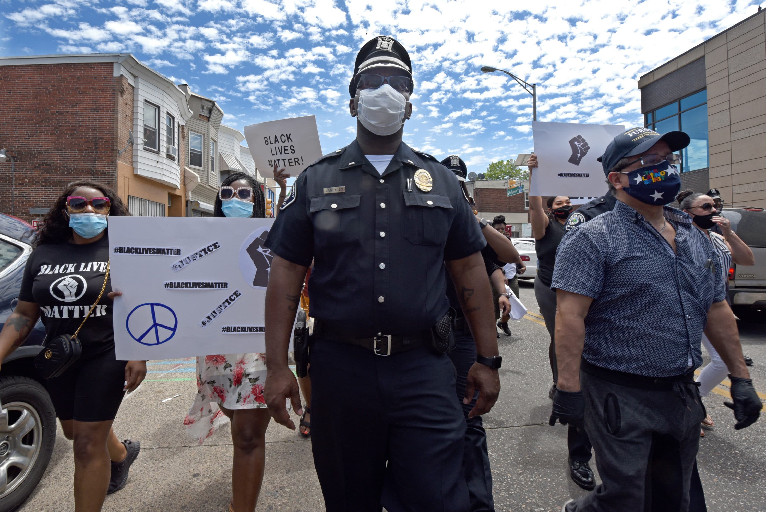 Lieutenant Zack James of the Camden County Metro Police Department marched along with demonstrators in Camden, NJ on May 30, 2020 to protest the killing of George Floyd in Minneapolis. (Photo by April Saul)