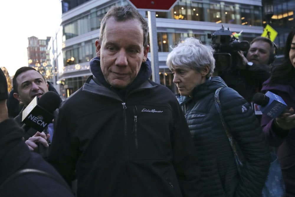 Harvard University professor Charles Lieber leaves the Moakley Federal Courthouse with his wife Jennifer, right, in Boston, Jan. 30, 2020. (Charles Krupa/AP)