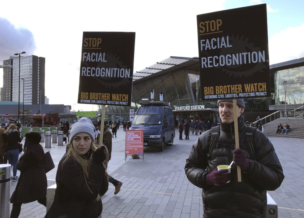Activists demonstrate in front of a mobile police facial recognition facility in London on Feb. 11, 2020. (Kelvin Chan/AP)
