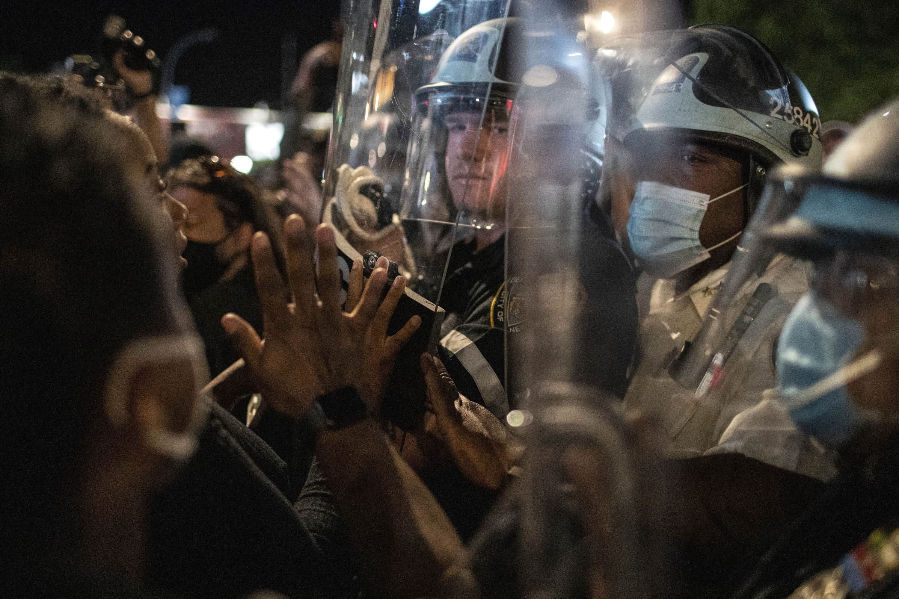 Police hold off protesters during a solidarity rally for George Floyd, Sunday, May 31, 2020, in Brooklyn, New York. (Wong Maye-E/AP)