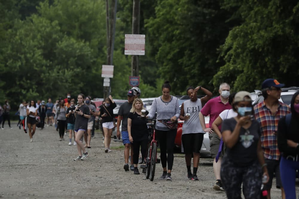 People wait in line to vote in Georgia's primary election at Park Tavern on Tuesday, June 9, 2020, in Atlanta. (Brynn Anderson/AP)