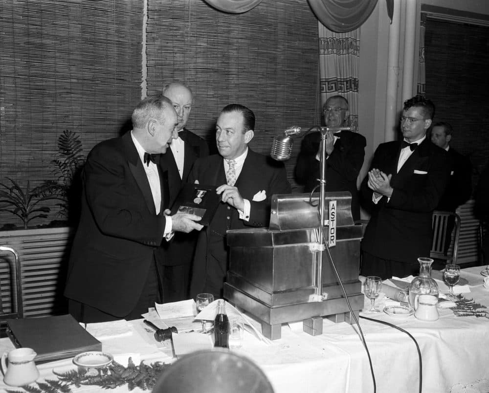 Robert Moses, city construction coordinator, receives the First Annual Gold Medal of the Metropolitan Amateur Athletic Union from Mayor Robert F. Wagner, right, at a dinner for Robert Moses at the Astor Hotel, New York, April 28, 1954. (Tom Fitzsimmons/AP)