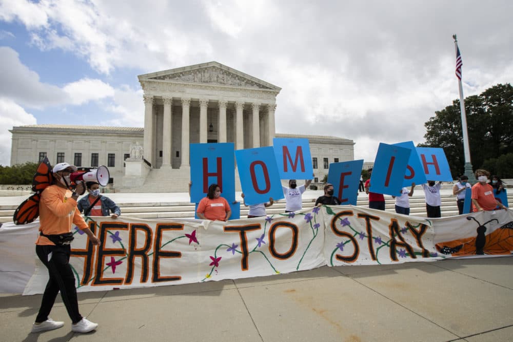 DACA recipient Roberto Martinez, left, celebrates with other DACA recipients in front of the Supreme Court in Washington on Thursday. (AP Photo/Manuel Balce Ceneta)