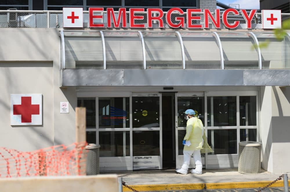 A medical worker enters the emergency room at a hospital on April 15, 2020 in Brooklyn. (Angela Weiss/AFP/Getty Images)