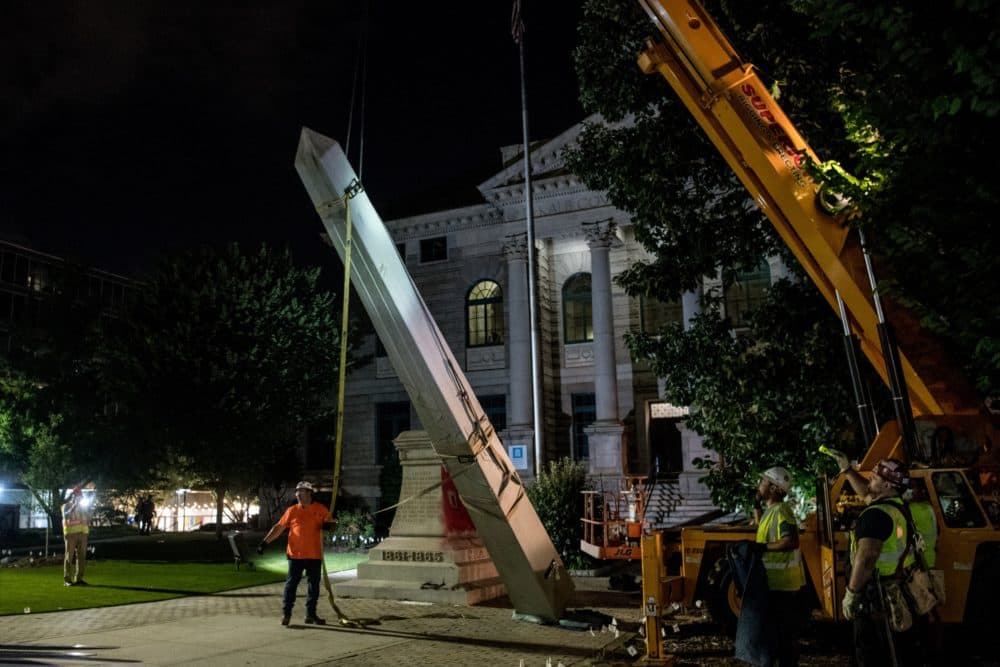 Crew members work to remove a 30-foot Confederate monument on June 19, 2020, in Decatur, northeast of Atlanta, Georgia. (Chandan Khanna/AFP via Getty Images)
