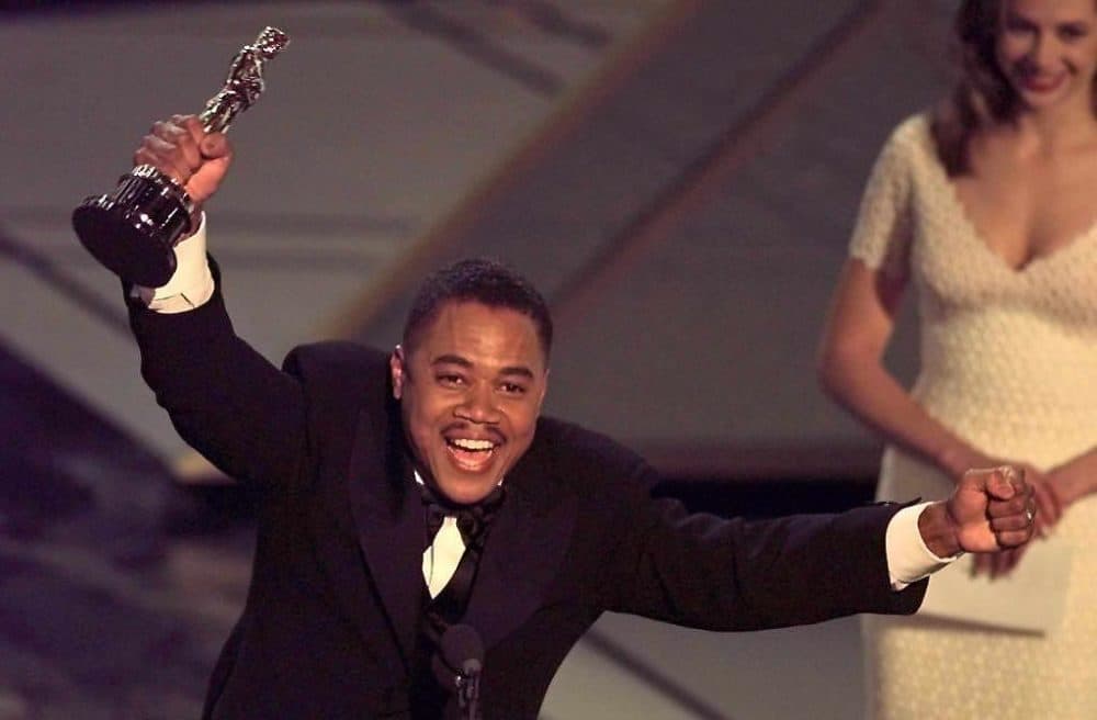 Cuba Gooding, Jr holds up his Oscar after winning the Best Supporting Actor Award for his role in &quot;Jerry Maguire&quot; during the 1997 Academy Awards. (Timothy A. Clary/AFP via Getty Images)