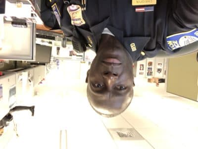 Boston Police Sergeant Eddy Chrispin sitting at his office. (Courtesy Eddy Chrispin)