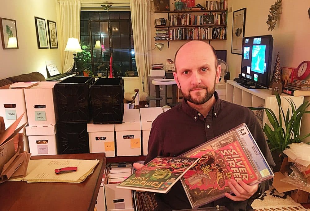 Matt Marlin shows off a few of his &quot;grail&quot; comic books at his home in Boston. (Courtesy)
