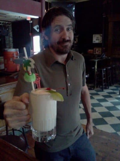 Talent buyer Carl Lavin enjoying a piña colada at Great Scott. (Courtesy)